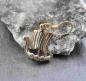 Preview: Wikinger Drachenboot Ohrhänger aus Bronze vor einem Stein
